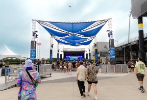 A festival stage with blue overhangs.